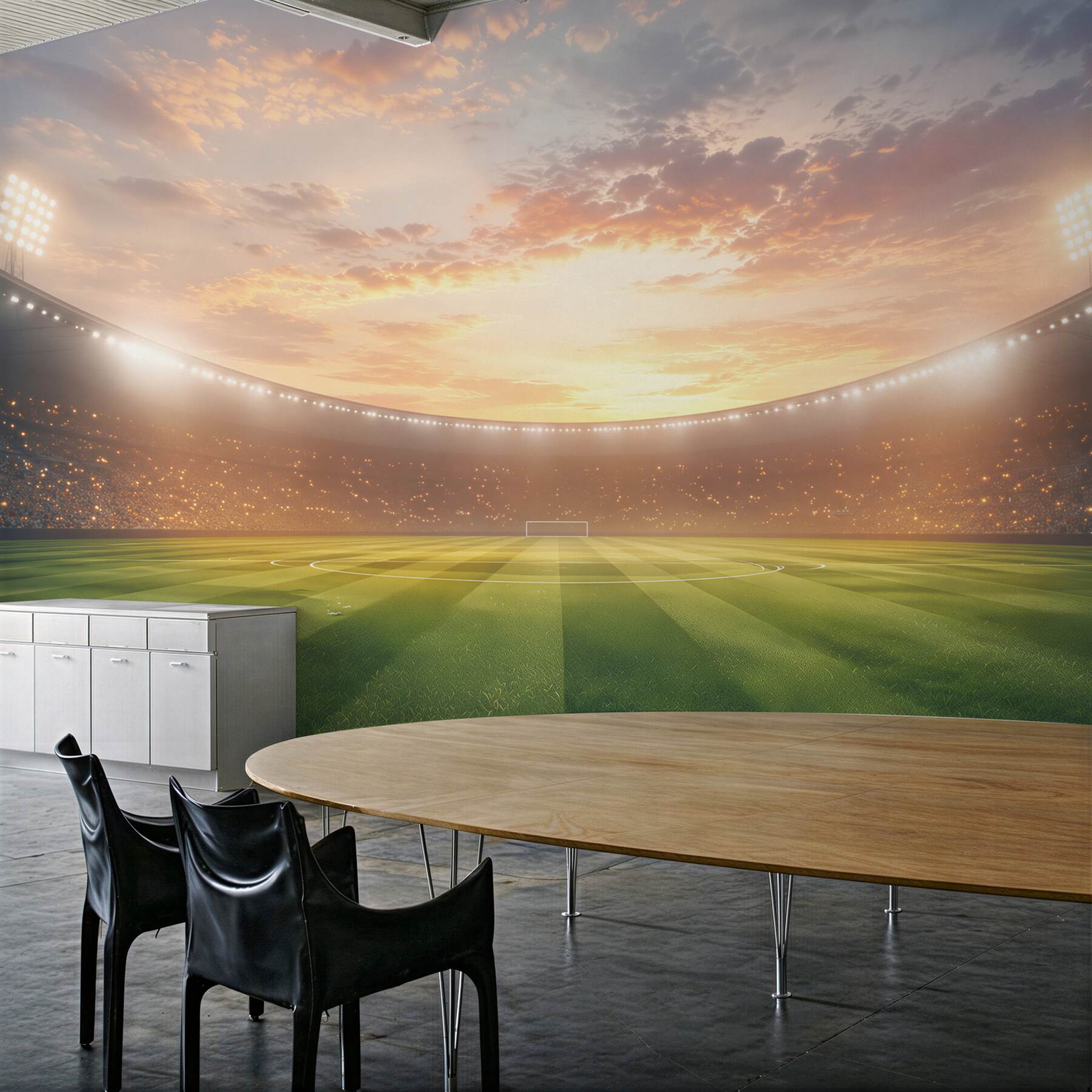 Papier peint stade de football au coucher du soleil avec un gazon vert