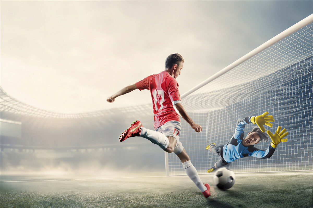 Papier peint footballeur tirant au but